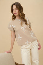 BOW PATTERN ROUND NECK SHORT SLEEVE KNIT SWEATER