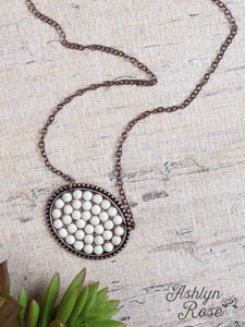 Bumpily Bamboozled Bronze Necklace With A Cream Pendant j